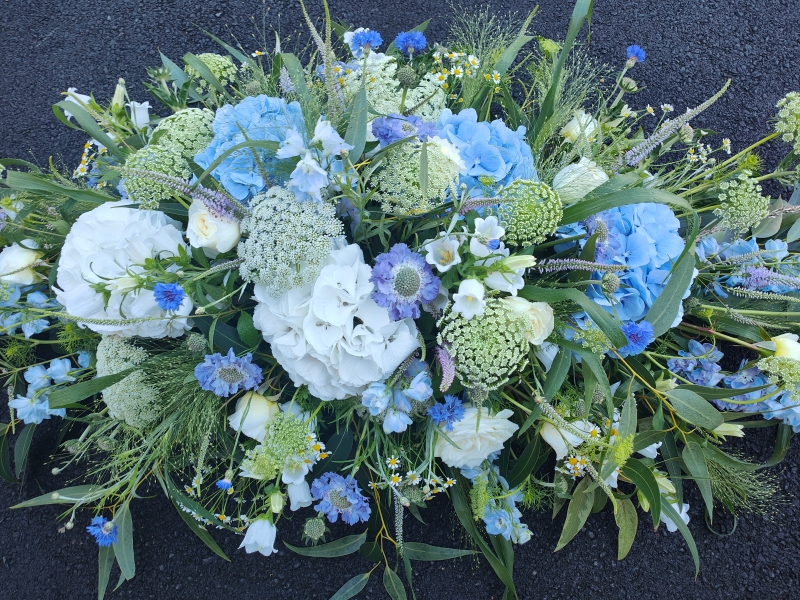 White and Blue hydrangea casket spray