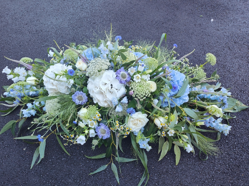 White and Blue hydrangea casket spray