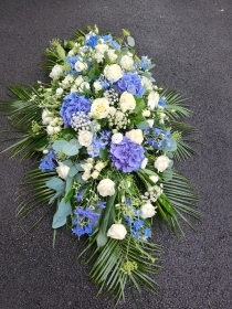 Blue and white casket spray