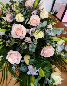 Rose Lilly and Lisianthus casket Spray