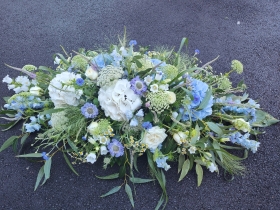 White and Blue hydrangea casket spray