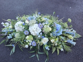 White and Blue hydrangea casket spray